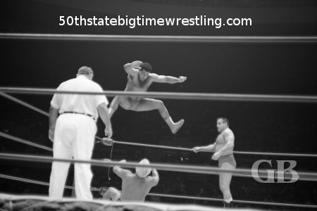 Pedro Morales comes off the top ropes onto a horrified Angelo Poffo.