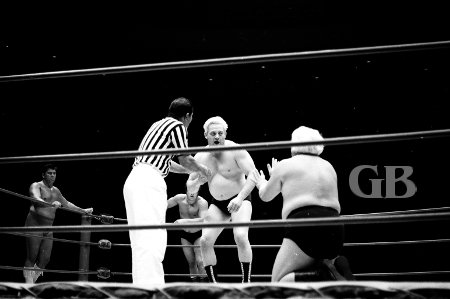 Ripper Collins takes his favorite stance and begs for mercy as Ray Stevens moves in.