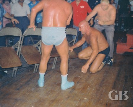 Blassie and Haggerty battle outside the ring. Haggerty's head is cut open.