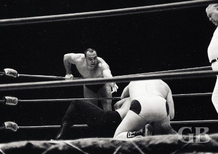 The Mongolian Stomper stretches to tag his partner Cyclone Negra.