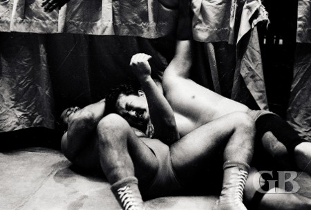 Pedro Morales and Harry Fujiwara outside the ring on the concrete floor.