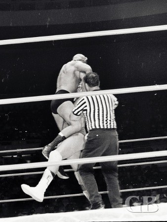 Ernie Ladd lifts up Hans Mortier by the neck and prepares to slam him.