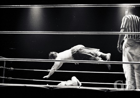 Klondike Bill suspended in mid-air as he splashes Frank Mcfarlane.