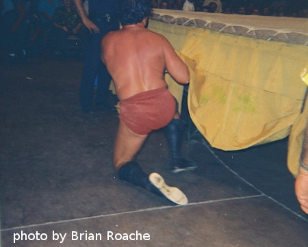 Johnny Barend comes out from under the ring without the leather strap.
