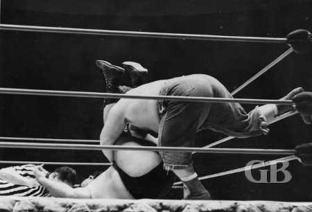 Klondike Bill illegally pins Curtis Iaukea using the ropes.