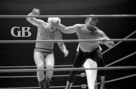 Dutch Schultz throwing Pat Patterson out of the ring.