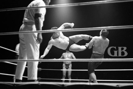 Jim Hady lands a perfect Drop Kick on Kenji Shibuya.