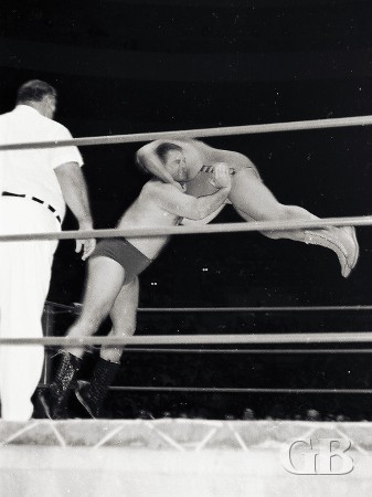 Cowboy Bill Watts about to throw Ripper Collins across the ring.